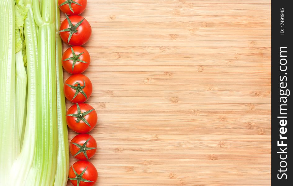 Tomatos cherry. green salad on cutting board. Tomatos cherry. green salad on cutting board