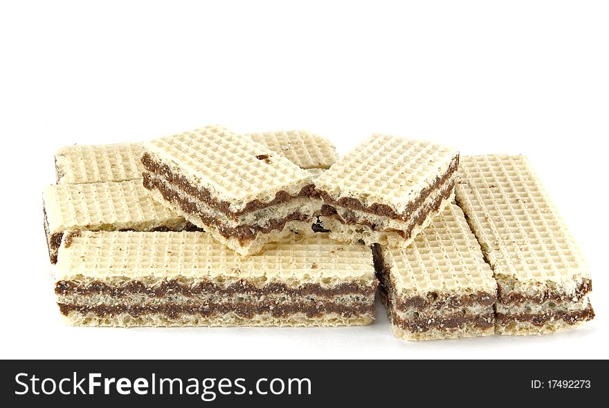 Stack of chocolate wafers on white background