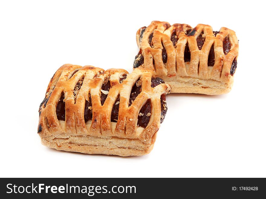 Sweet biscuits and jam on white background