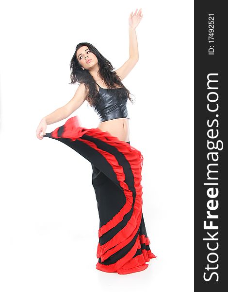 Studio shot of young woman dancing latino over white