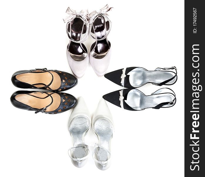 Four pairs of women's shoes on a white background