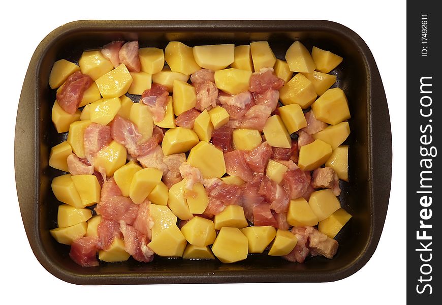 Meat and potatoes in trays, isolated on a white background