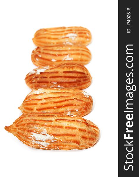 Delicious eclairs arranged unlikely on a white background