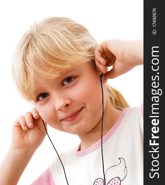 Little girl in headphones, white background