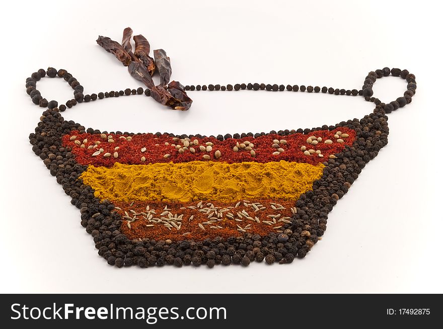 Spice bowl made of spices, peppercorns on white background