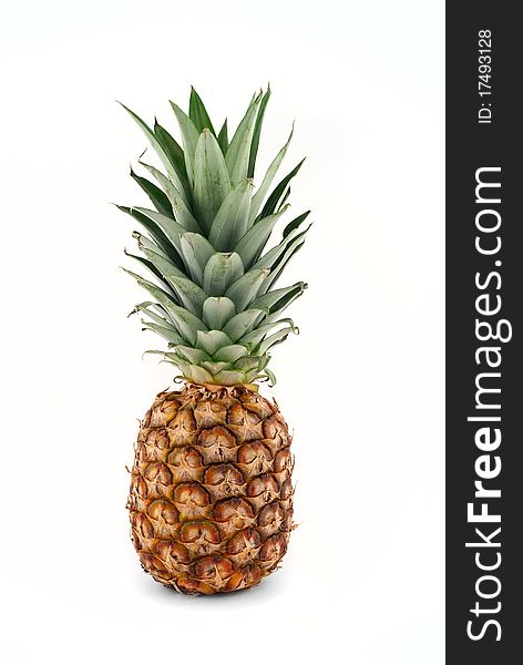 Ripe pineapple on a white background isolated. Ripe pineapple on a white background isolated