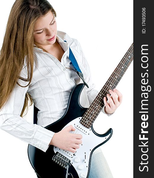 Teen girl holding a guitar like a rock star