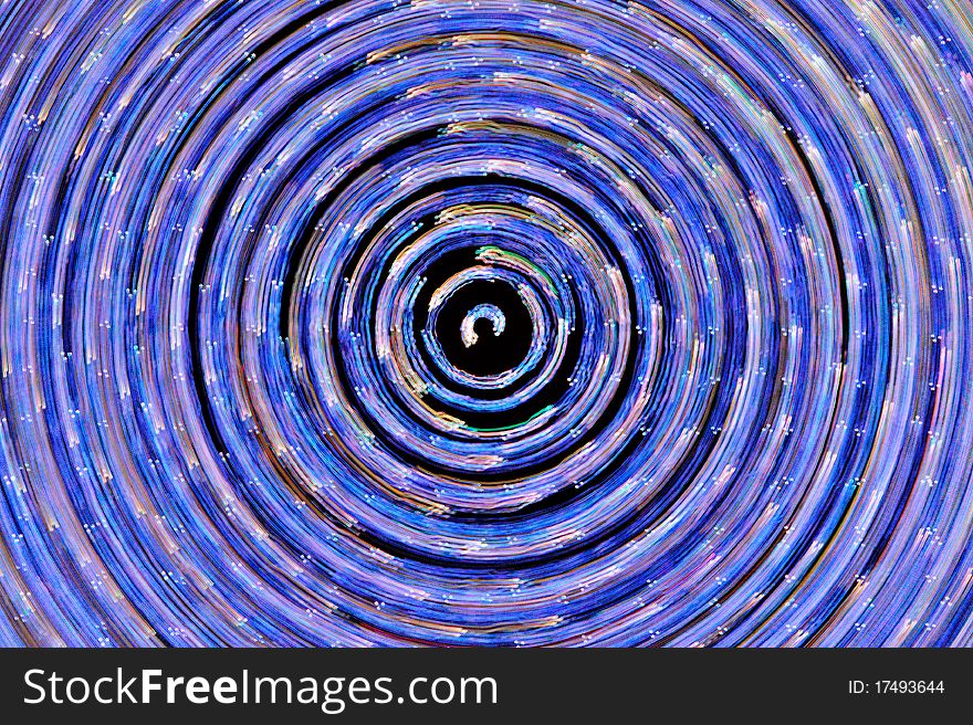 Blue light swirls around the center to form abstract. Blue light swirls around the center to form abstract