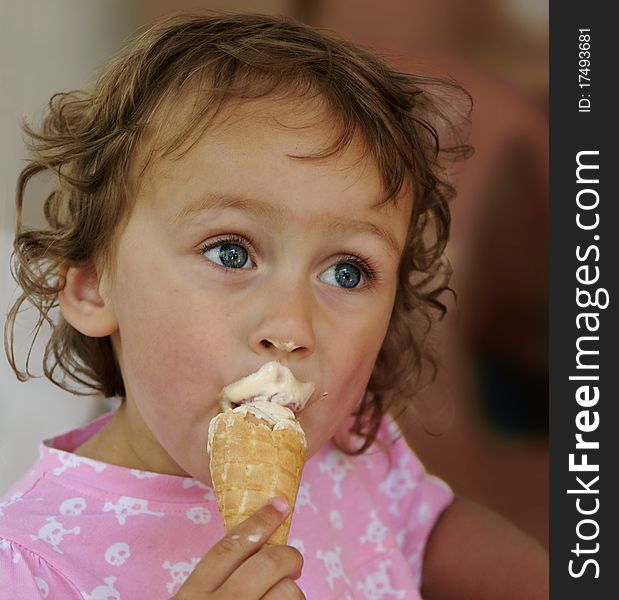 Cute little girl eating ice cream. Cute little girl eating ice cream