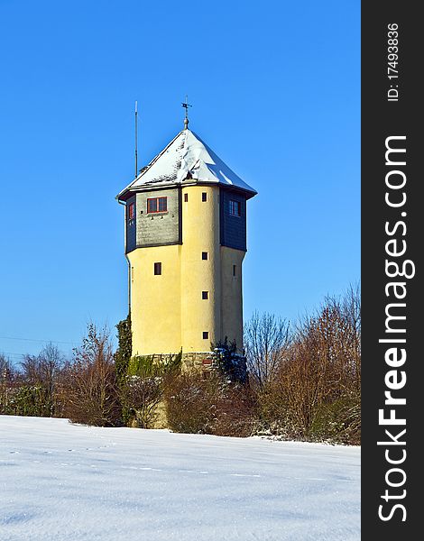 Watertower in  snow covered fields