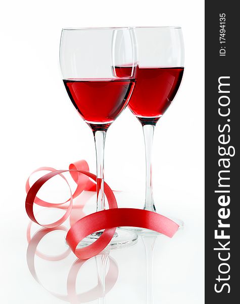 Glass of red wine on a white background and with soft shadow