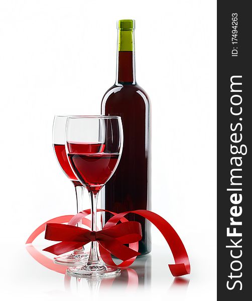 Bottle with red wine and glass a decorative tape