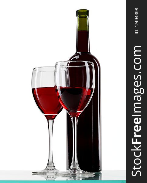 Bottle with red wine and glass