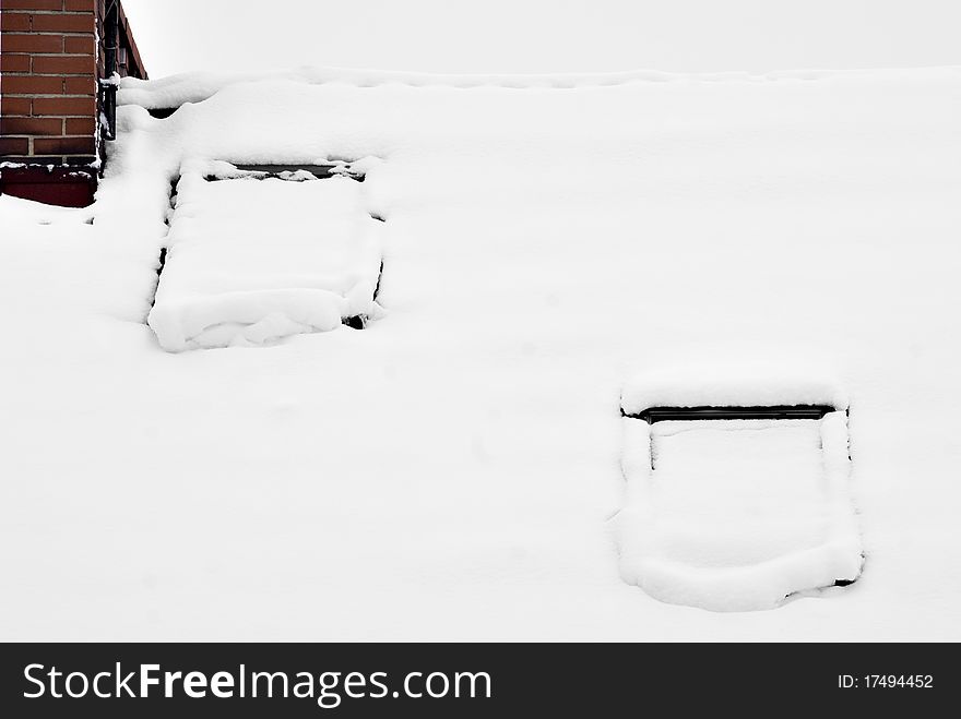 The photography of the top of single-family home covered by snow. Taken on 2010. The photography of the top of single-family home covered by snow. Taken on 2010.