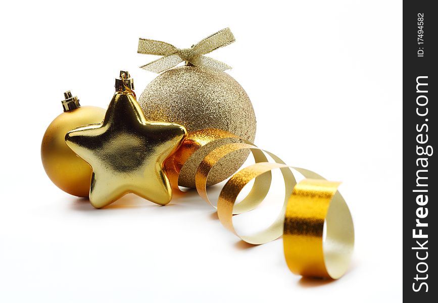 Christmas golden balls hanging with ribbons on white background