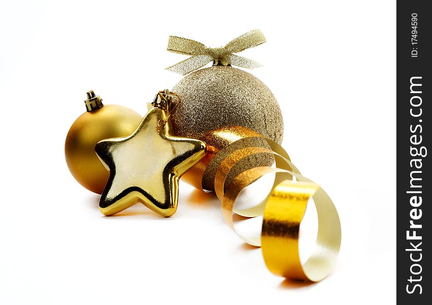 Christmas golden balls hanging with ribbons on white background