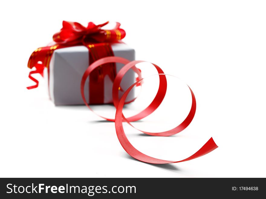 Gift box with red bow isolated on white