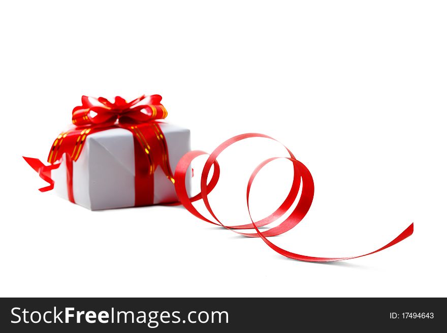 Gift box with red bow isolated on white