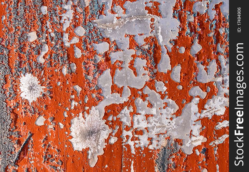 Red peeling paint on concrete wall background. Red peeling paint on concrete wall background.