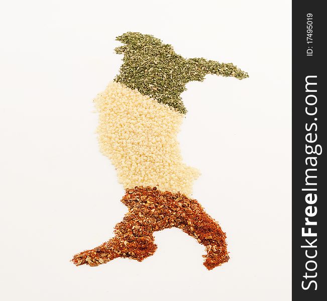 Spices in shape of italian map in three colours green white and red on white background. Spices in shape of italian map in three colours green white and red on white background