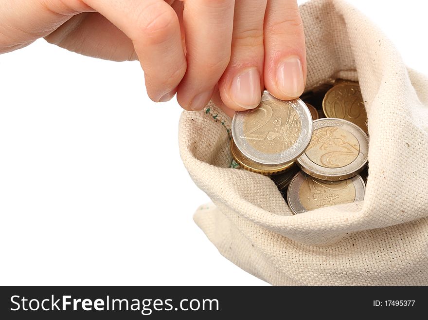 Close-up of a sack filled with coins isolated on neutral background
