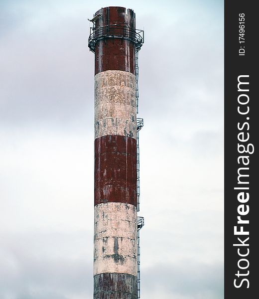 Urban and old smokestack with sky background