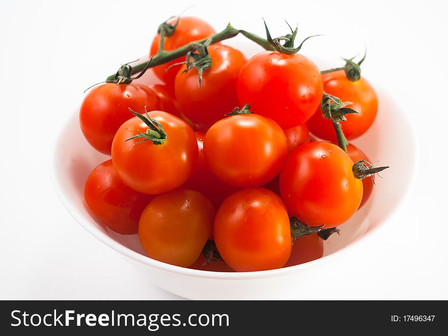Cherry tomatoes in white pot. Cherry tomatoes in white pot