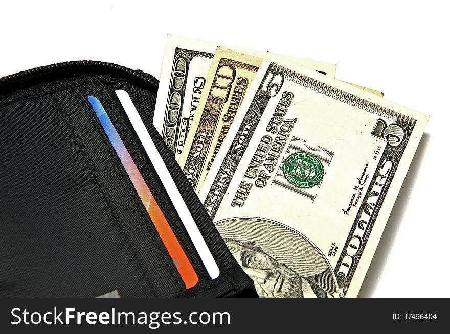Several dollar bills in purse on a white background