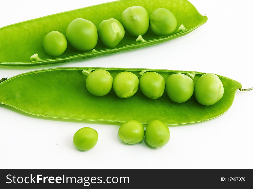 Fresh green pea pod and peas on white background. Fresh green pea pod and peas on white background.