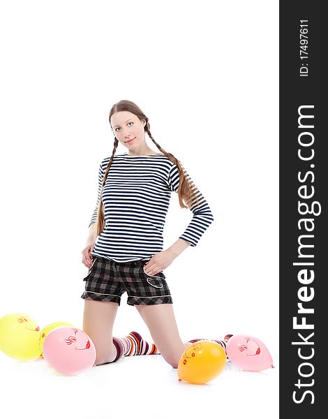 A pretty girl dressed in casual clothes playing with baloons. A pretty girl dressed in casual clothes playing with baloons