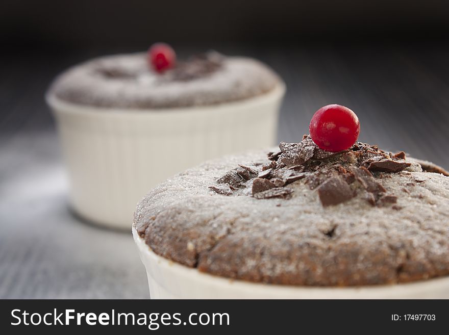 Chocolate souffle with chocolate chips and red currant