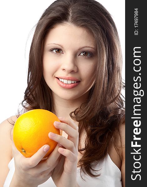 Beautiful young woman holding an orange. Close up. Beautiful young woman holding an orange. Close up