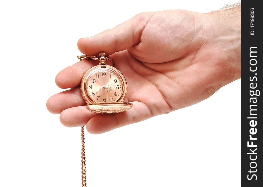 Golden pocket watch in hand on white