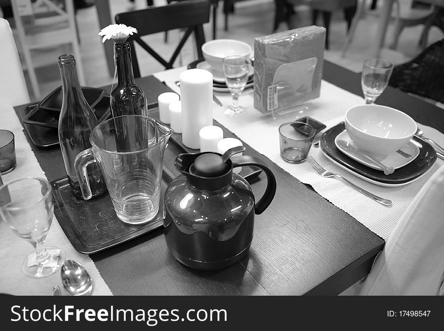 Display of luxury expensive designer dining set on a table,in black and white