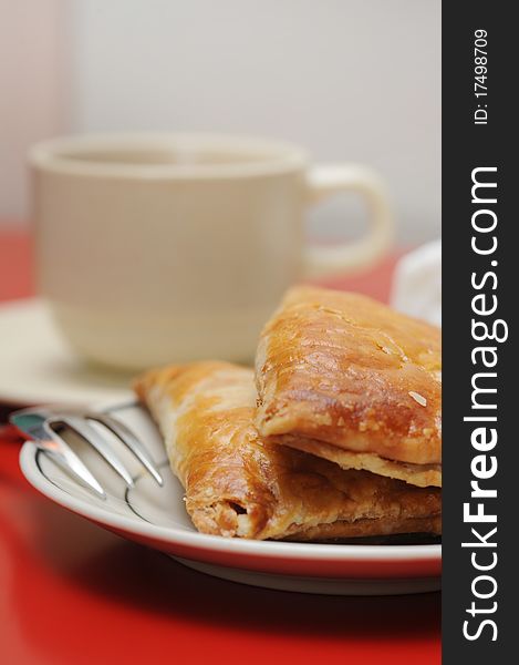 A cup of tea and delicious puff pastry. A cup of tea and delicious puff pastry.