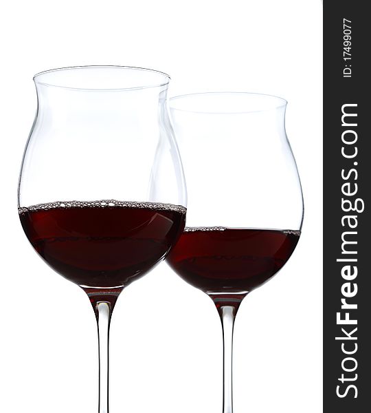 Half full wine glasses with red wine. Half full wine glasses with red wine