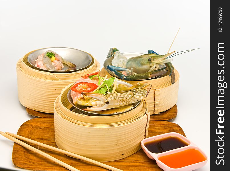 Chinese steamed dimsum in bamboo containers traditional cuisine. Chinese steamed dimsum in bamboo containers traditional cuisine