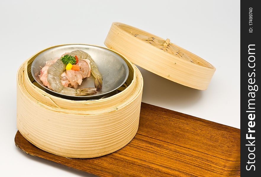 Chinese steamed shrimp dimsum in bamboo containers traditional cuisine. Chinese steamed shrimp dimsum in bamboo containers traditional cuisine