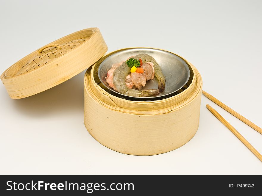 Chinese steamed shrimp dimsum in bamboo containers traditional cuisine. Chinese steamed shrimp dimsum in bamboo containers traditional cuisine