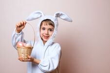 Cute Little Child Girl Wearing Bunny Costume On Easter Day. Girl With Easter Eggs In The Basket Stock Photos