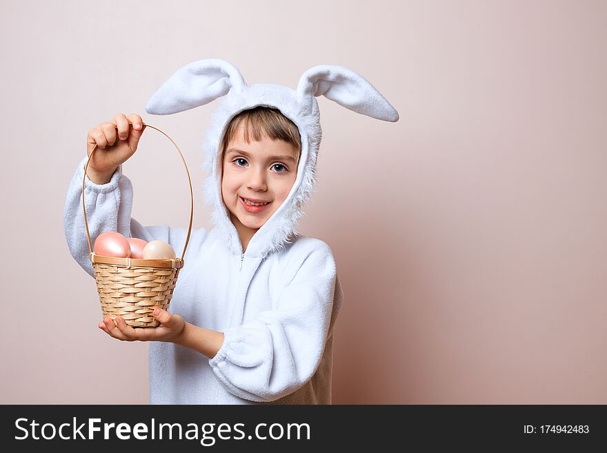 Cute Little Child Girl Wearing Bunny Costume On Easter Day. Girl With Easter Eggs In The Basket