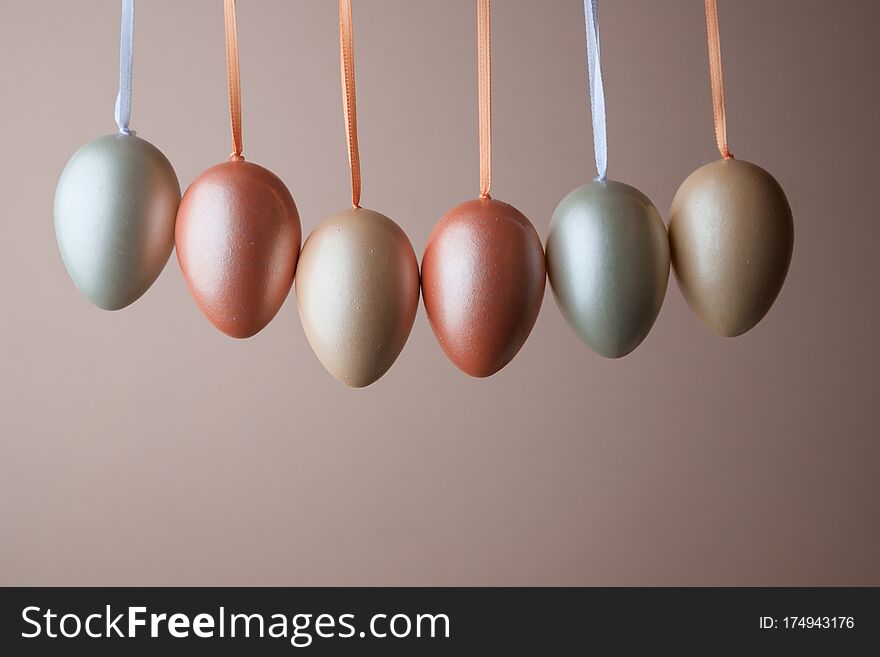 Decorated Pearl Easter Eggs On A Pink Background. Minimal Holiday Concept. Happy Easter Background. A Place For Text