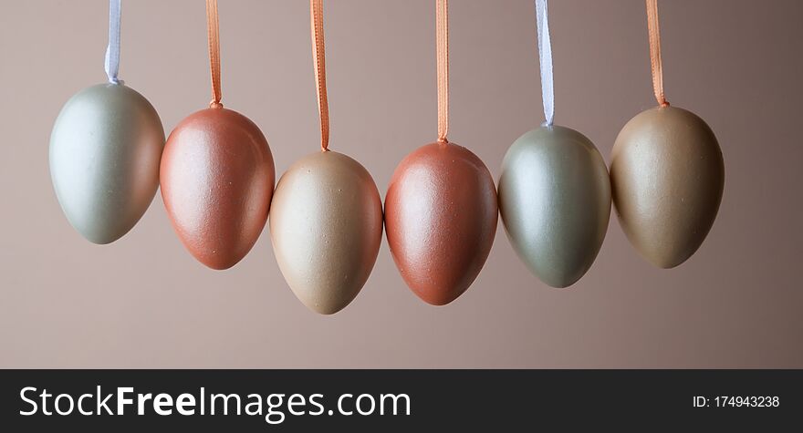 Decorated Pearl Easter Eggs On A Pink Background. Minimal Holiday Concept. Happy Easter Background. A Place For Text