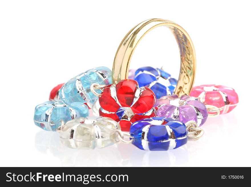 Wedding ring and colourfull beads.