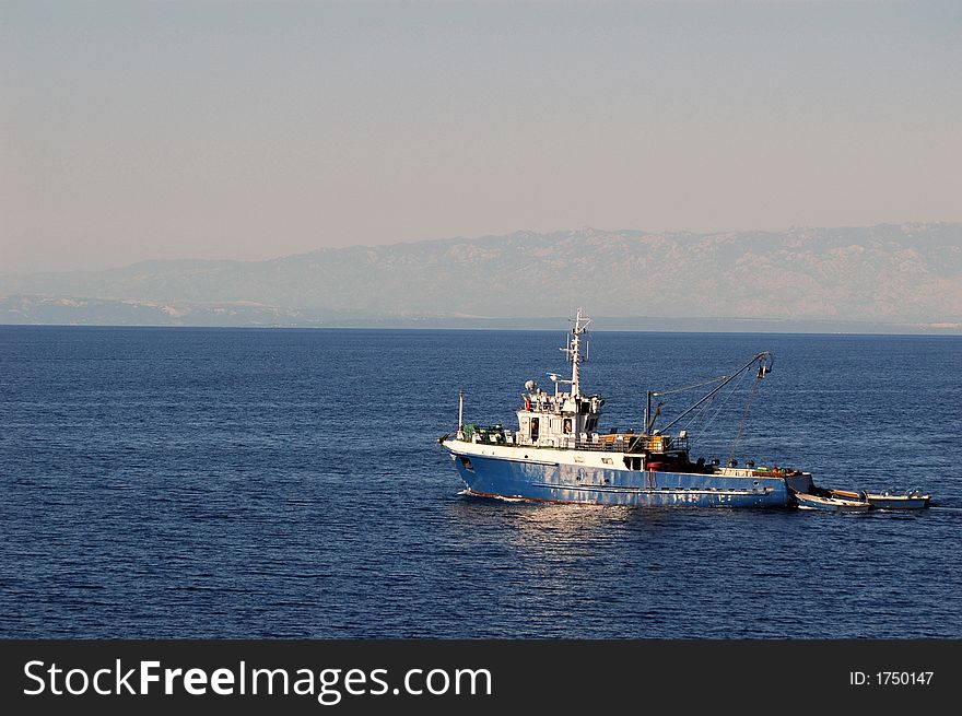 Fishermen ship in clear blue Adriatic sea. Fishermen ship in clear blue Adriatic sea