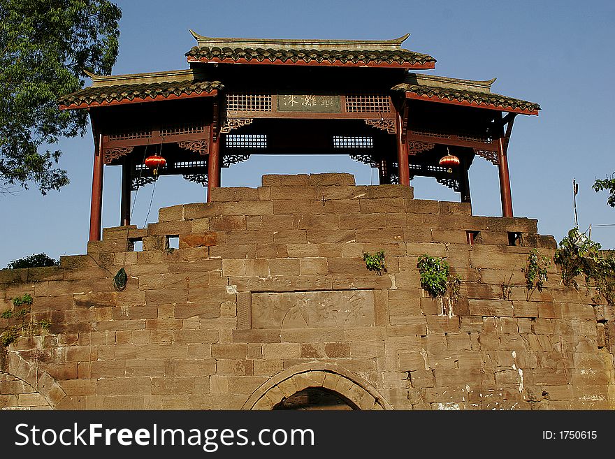 An antient style pavilion above old style bridge