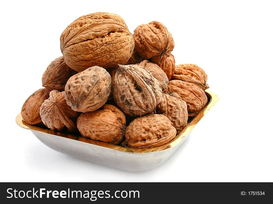Wild walnuts over a white background