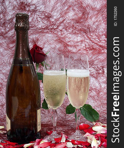 Champagne bottle and two cups for celebrate san valentine`s day