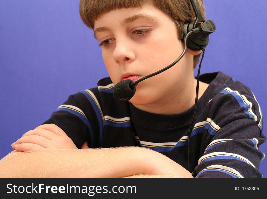 Young Boy On Telephone Blue Background