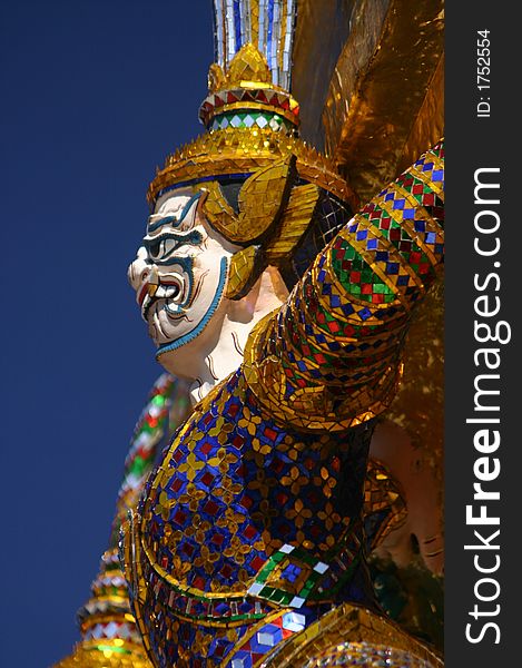 Guardian figure at Wat Phra Keo, Grand Palace, Bangkok, Thailand. Guardian figure at Wat Phra Keo, Grand Palace, Bangkok, Thailand.